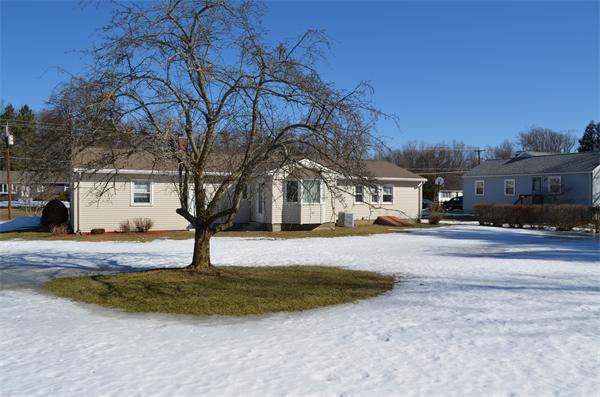 371 Wolf Swamp Road Longmeadow, MA 01106 - Photo 5 of 18 a house with trees in front of it