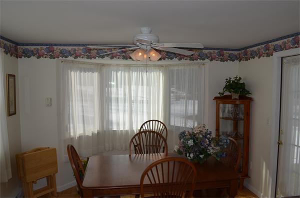 371 Wolf Swamp Road Longmeadow, MA 01106 - Photo 6 of 18 a view of a dining room with furniture and chandelier