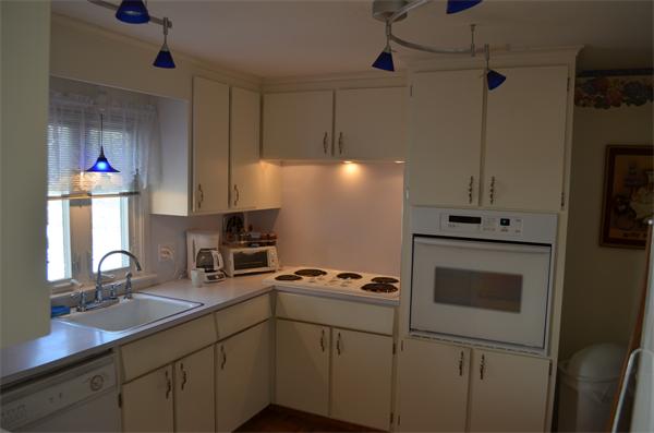 371 Wolf Swamp Road Longmeadow, MA 01106 - Photo 9 of 18 a kitchen with cabinets stainless steel appliances and a sink
