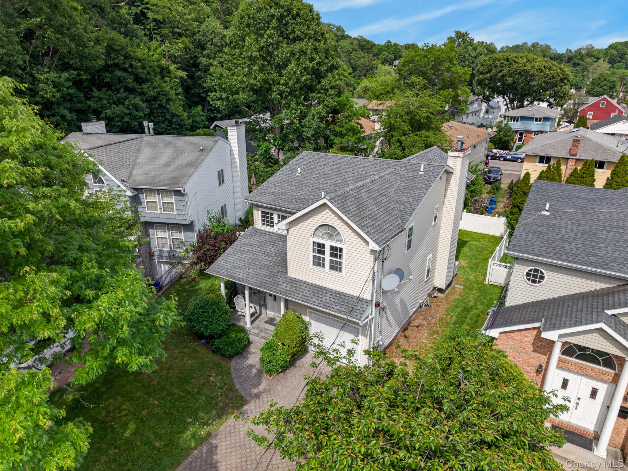 82 B Inwood Road Port Washington, NY 11050 - Photo 36 of 41 an aerial view of a house with a garden