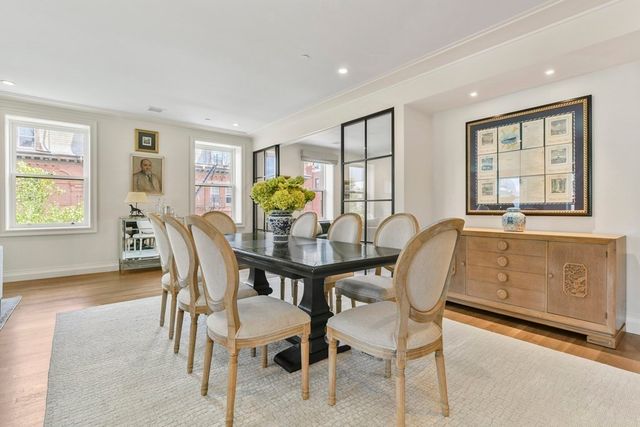 a view of a dining room with furniture and window