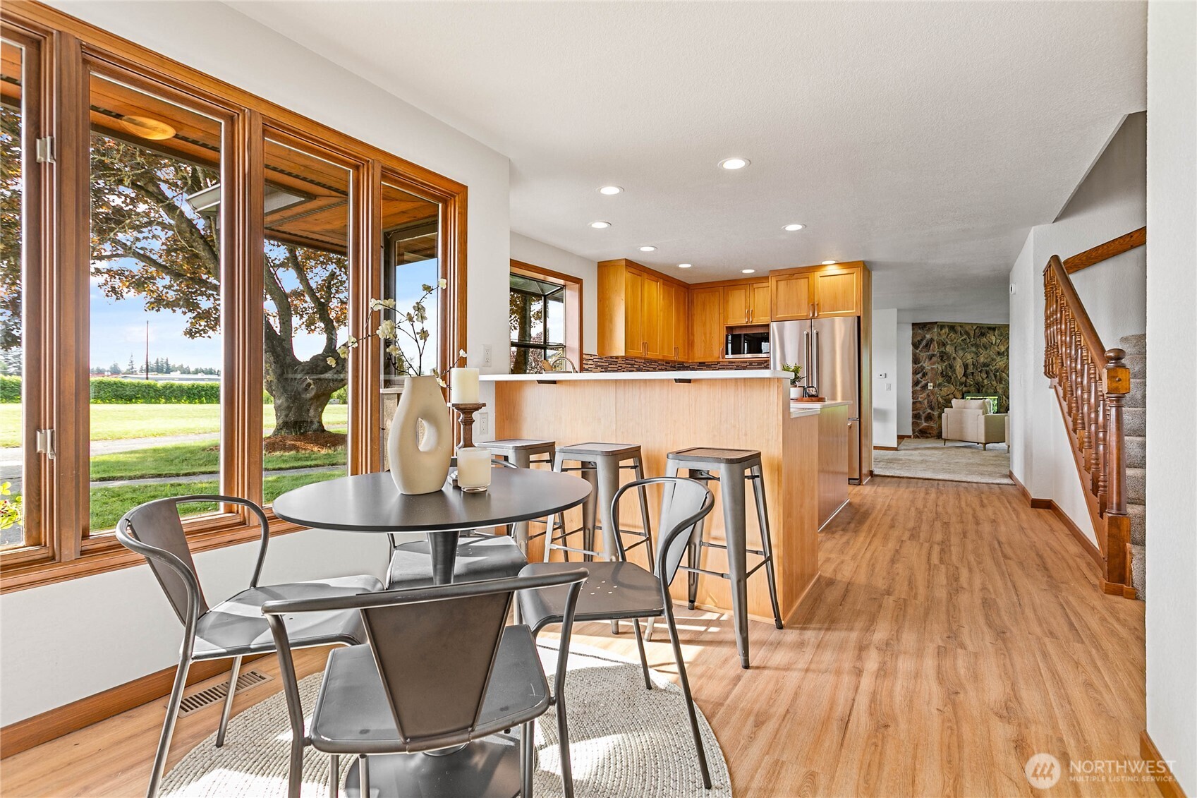 1133 East Pole Road Everson, WA 98247 - Photo 18 of 40 a view of a dining room with furniture and wooden floor