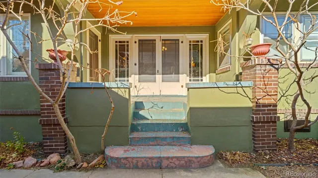 a view of a potted plants in front of a house