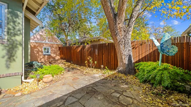 a backyard of a house with lots of green space