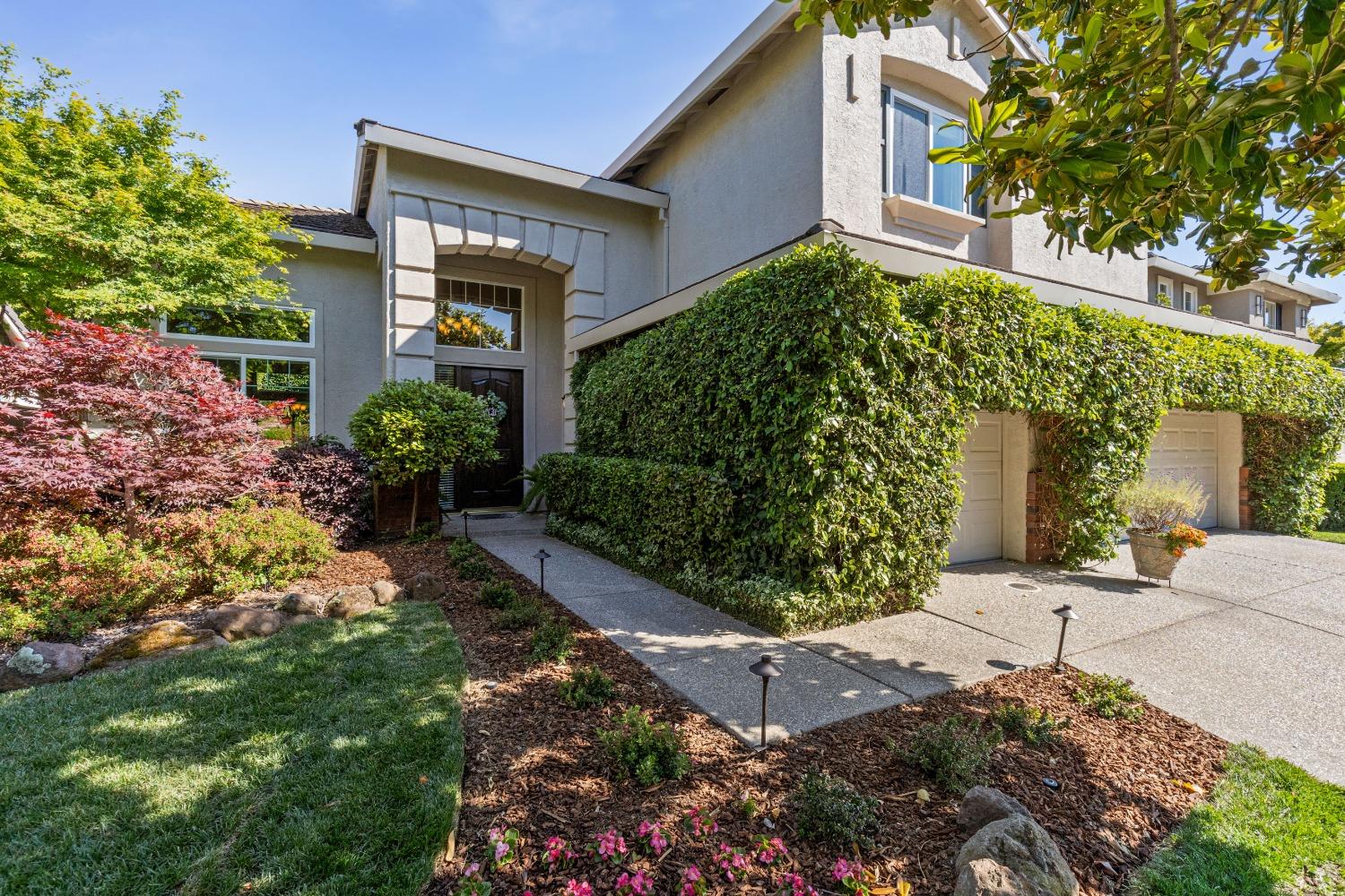 a front view of a house with a yard