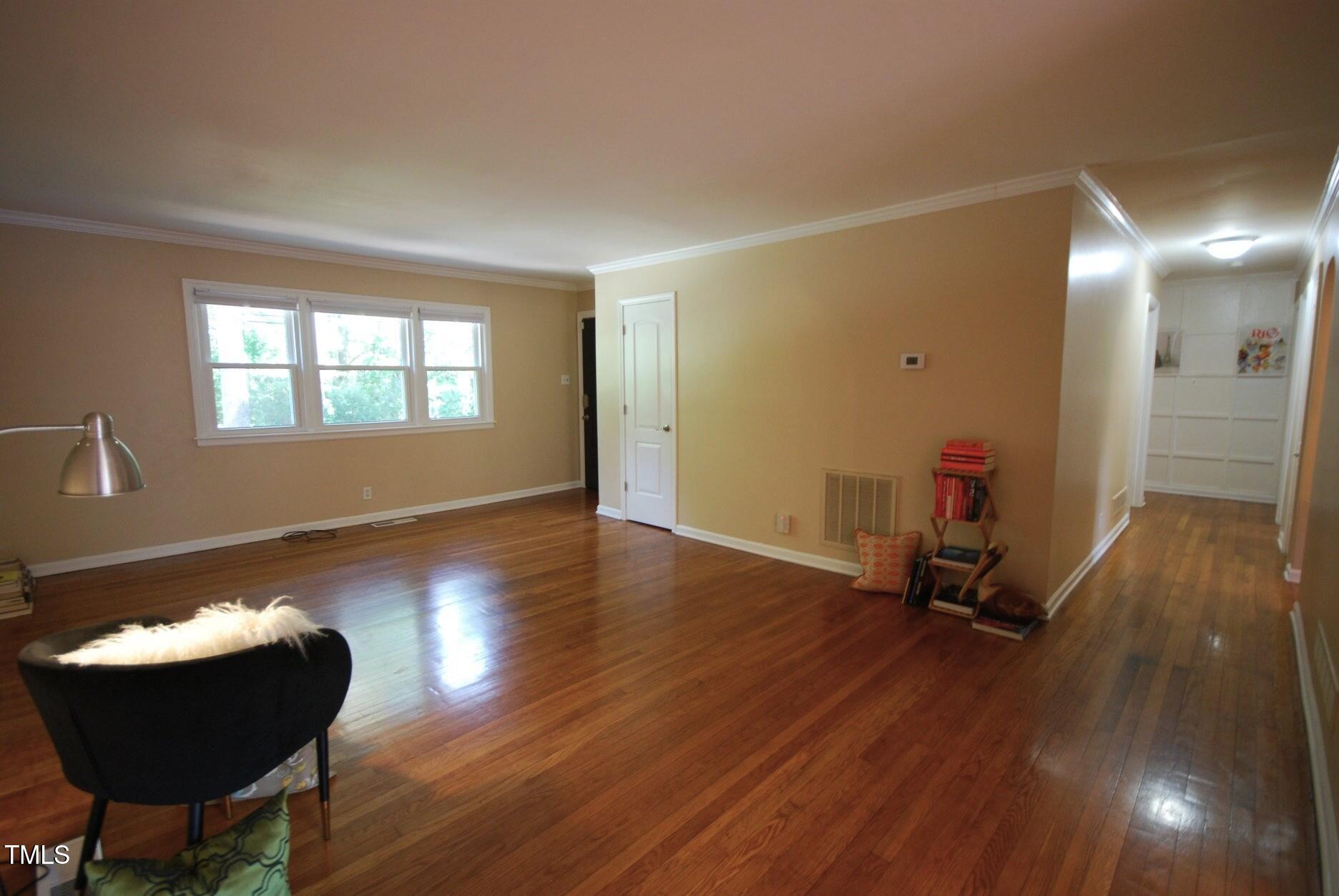 416 Morreene Road Durham, NC 27705 - Photo 11 of 28 a view of a room with gym equipment and wooden floor