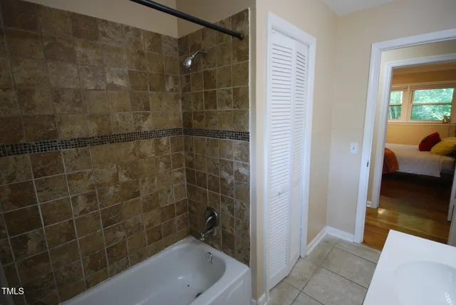 a bedroom with a bed and windows