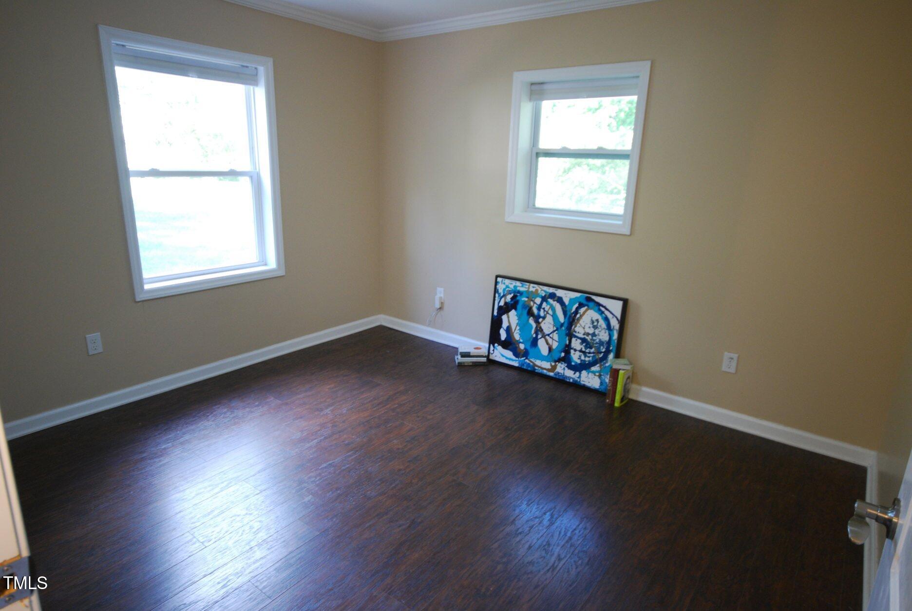 416 Morreene Road Durham, NC 27705 - Photo 16 of 28 a view of a room with wooden floor and window