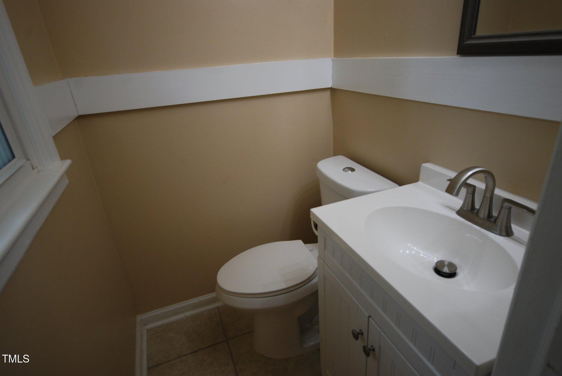 416 Morreene Road Durham, NC 27705 - Photo 18 of 28 a bathroom with a sink and a toilet