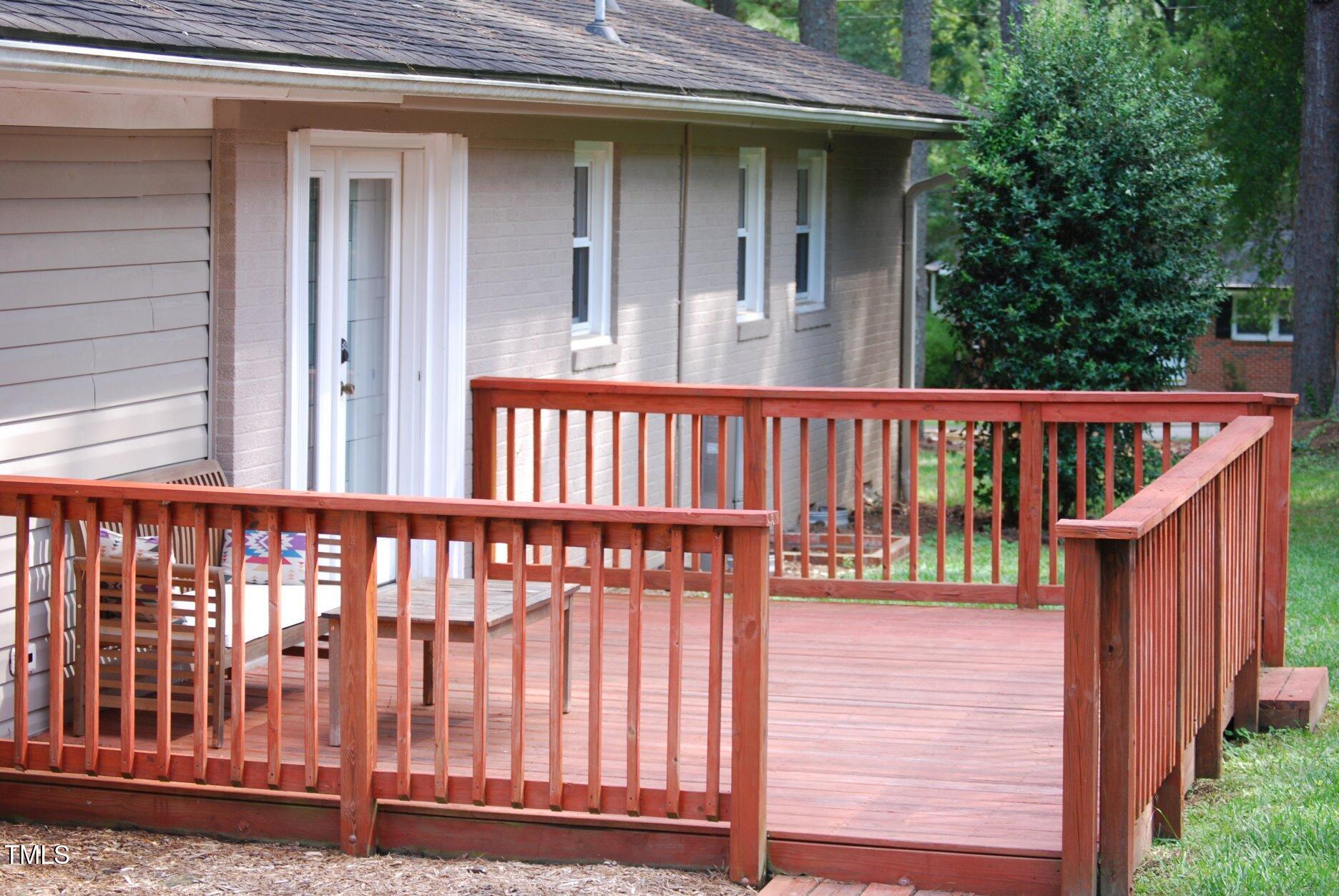 416 Morreene Road Durham, NC 27705 - Photo 22 of 28 a view of a wooden house with a small yard