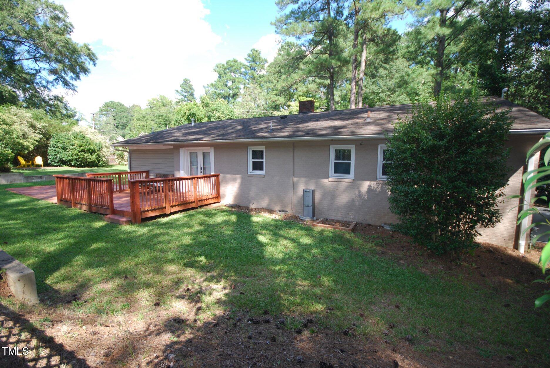 416 Morreene Road Durham, NC 27705 - Photo 26 of 28 a view of backyard with outdoor seating and green space