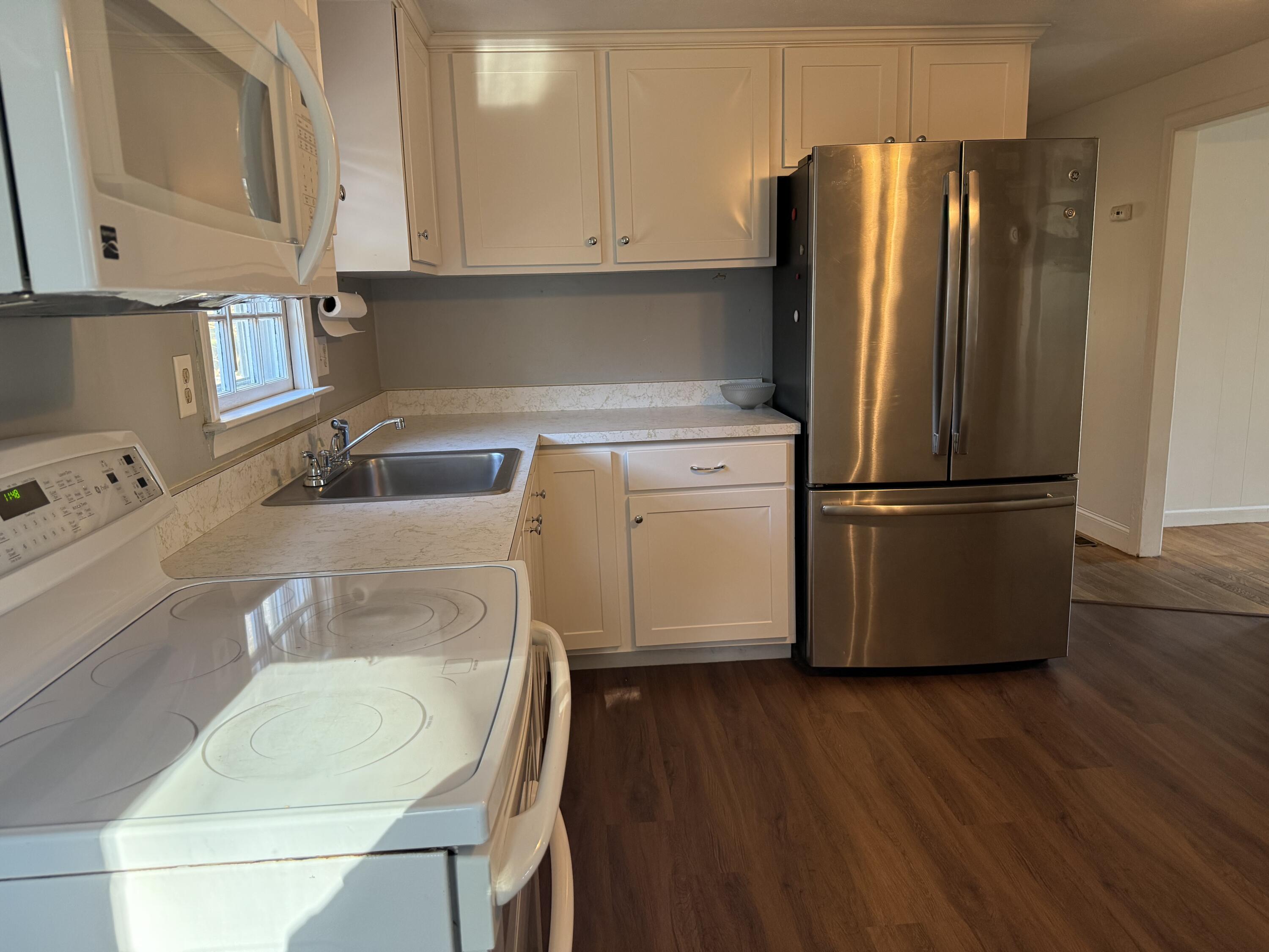 5 Huckleberry Lane Marstons Mills, MA 02648 - Photo 3 of 14 a kitchen with a refrigerator sink and cabinets