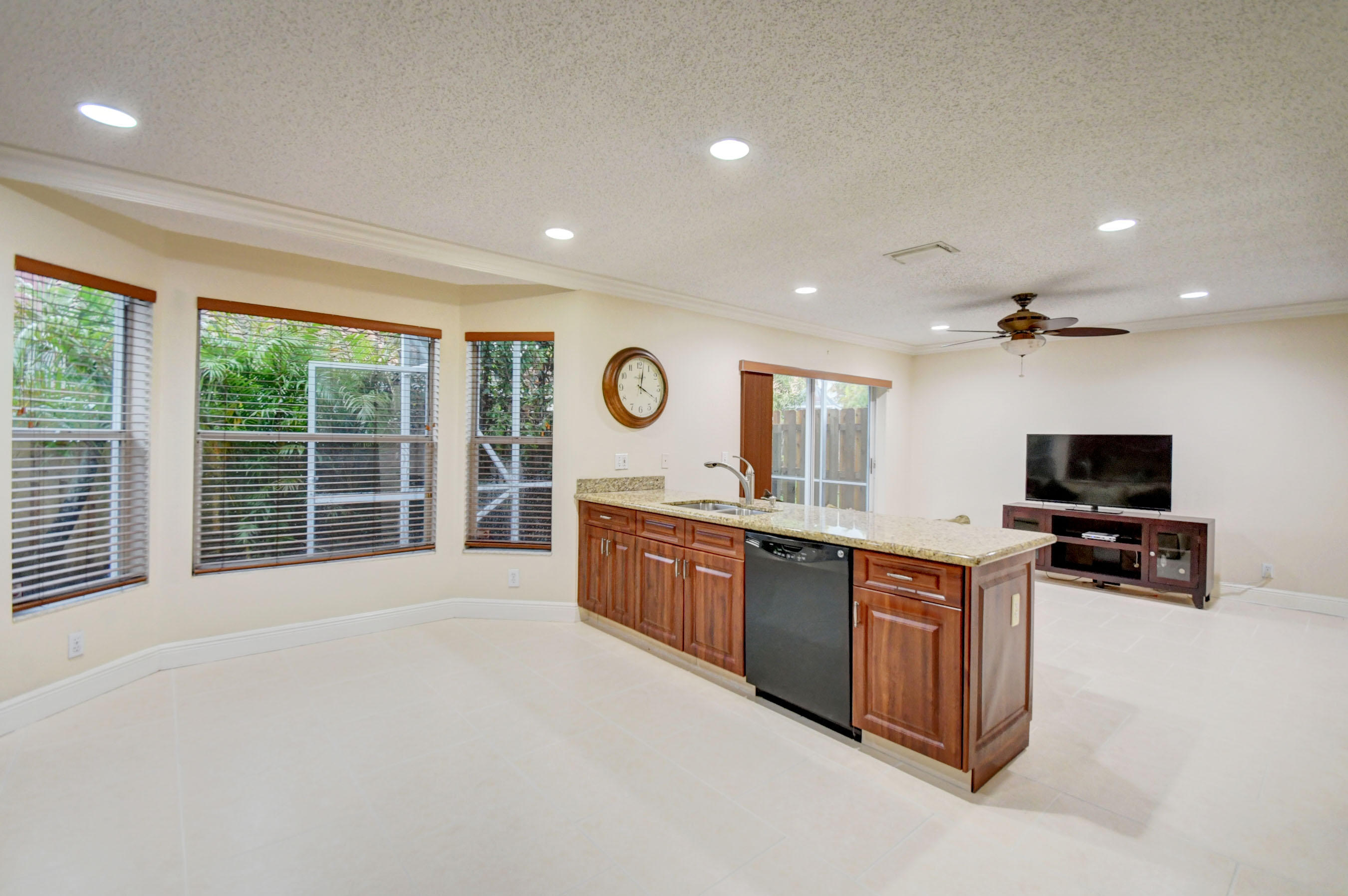 10620 Lake Jasmine Drive Boca Raton, FL 33498 - Photo 11 of 41 a large kitchen with stainless steel appliances granite countertop a large counter top a stove and a sink