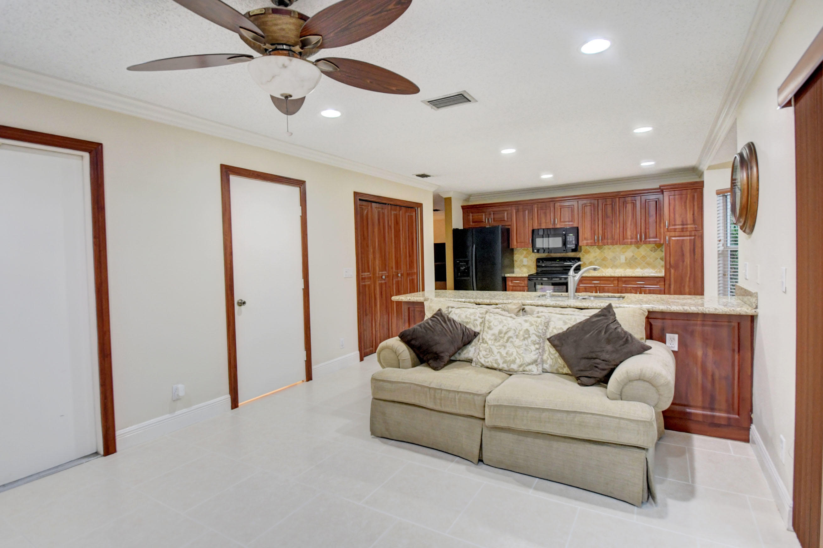 10620 Lake Jasmine Drive Boca Raton, FL 33498 - Photo 14 of 41 a living room with furniture and a large window