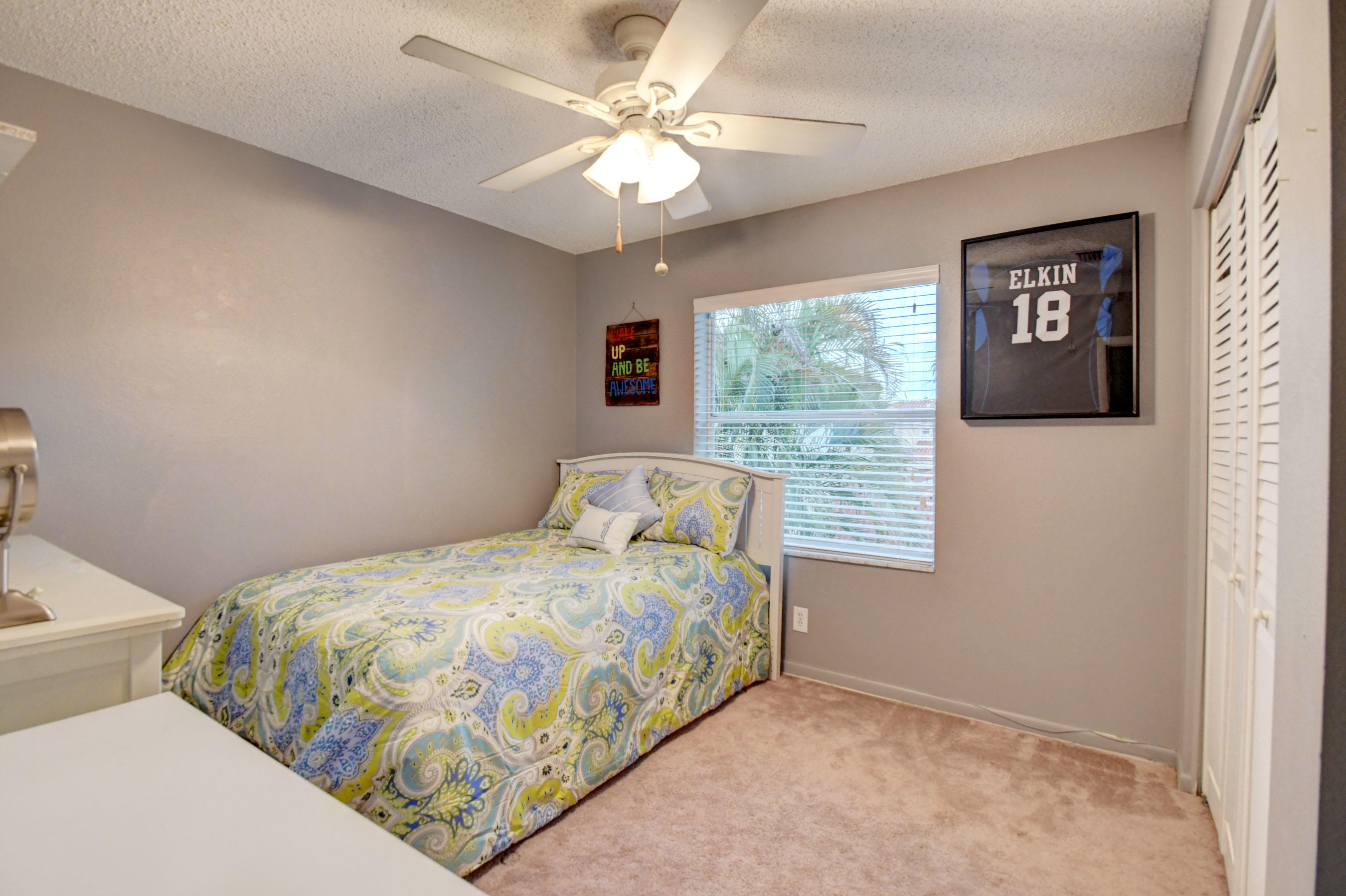 10620 Lake Jasmine Drive Boca Raton, FL 33498 - Photo 24 of 41 a bedroom with a bed and a window