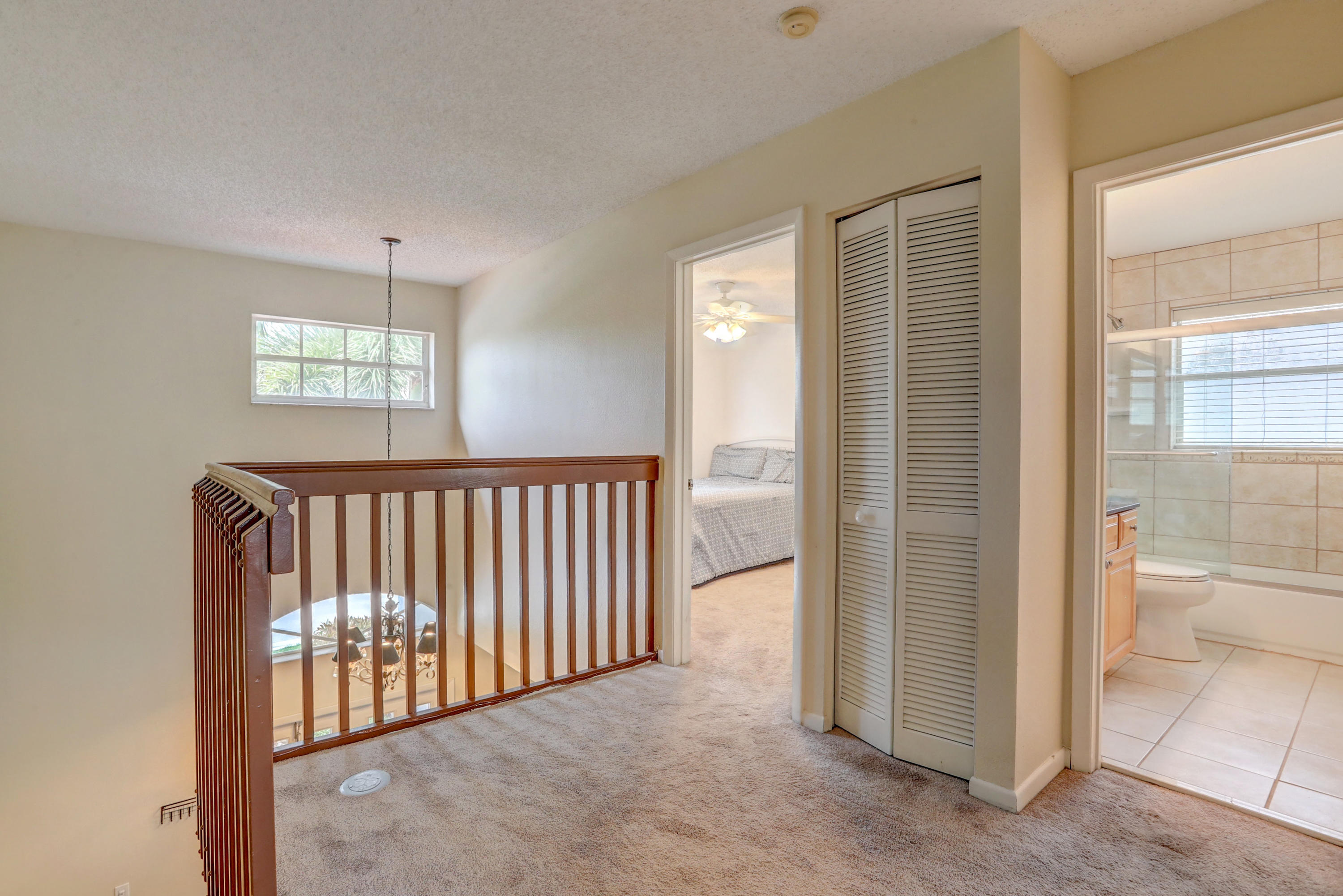 10620 Lake Jasmine Drive Boca Raton, FL 33498 - Photo 26 of 41 a view of a hallway with windows and entryway