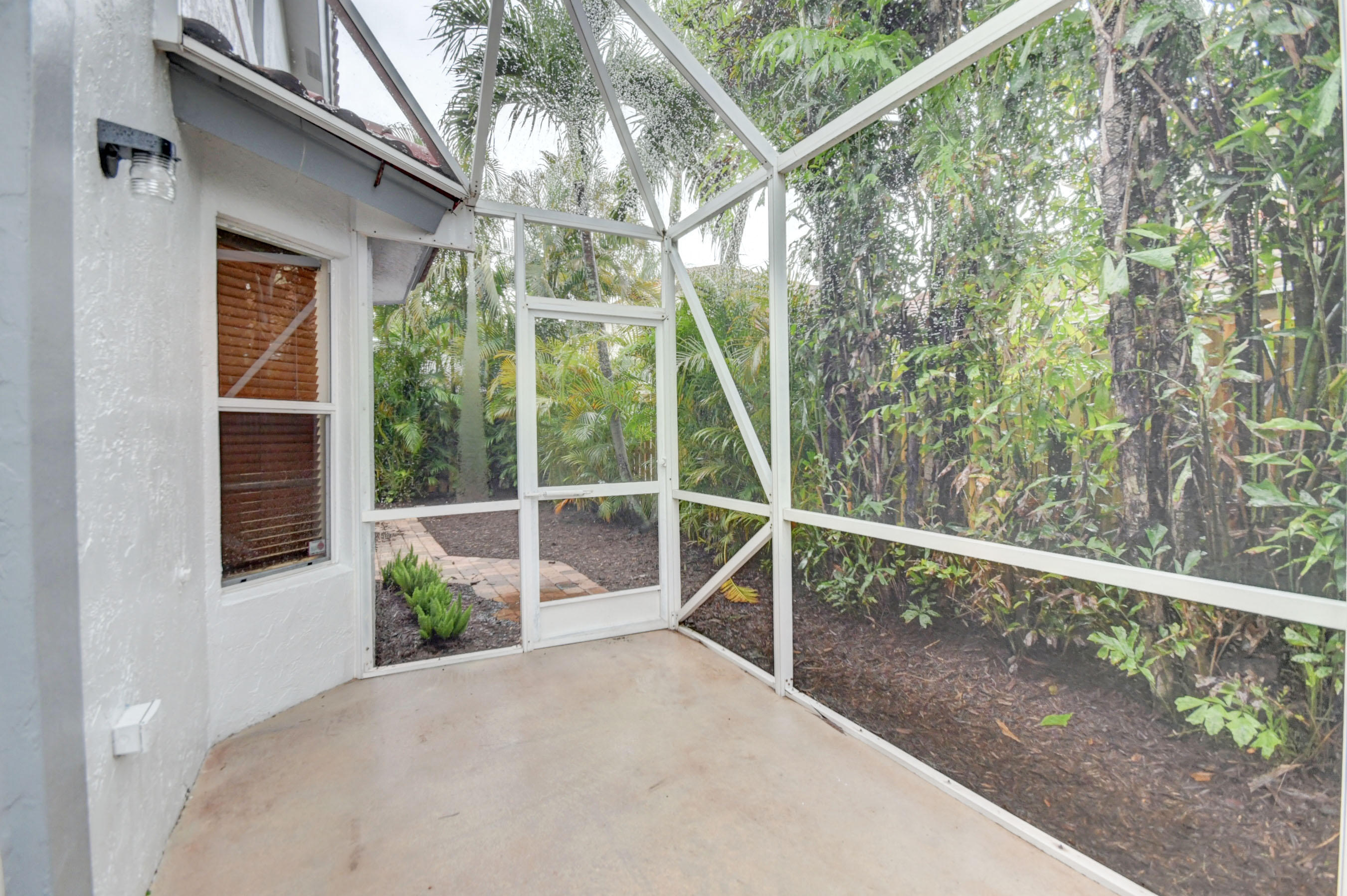 10620 Lake Jasmine Drive Boca Raton, FL 33498 - Photo 29 of 41 a view of a balcony with trees
