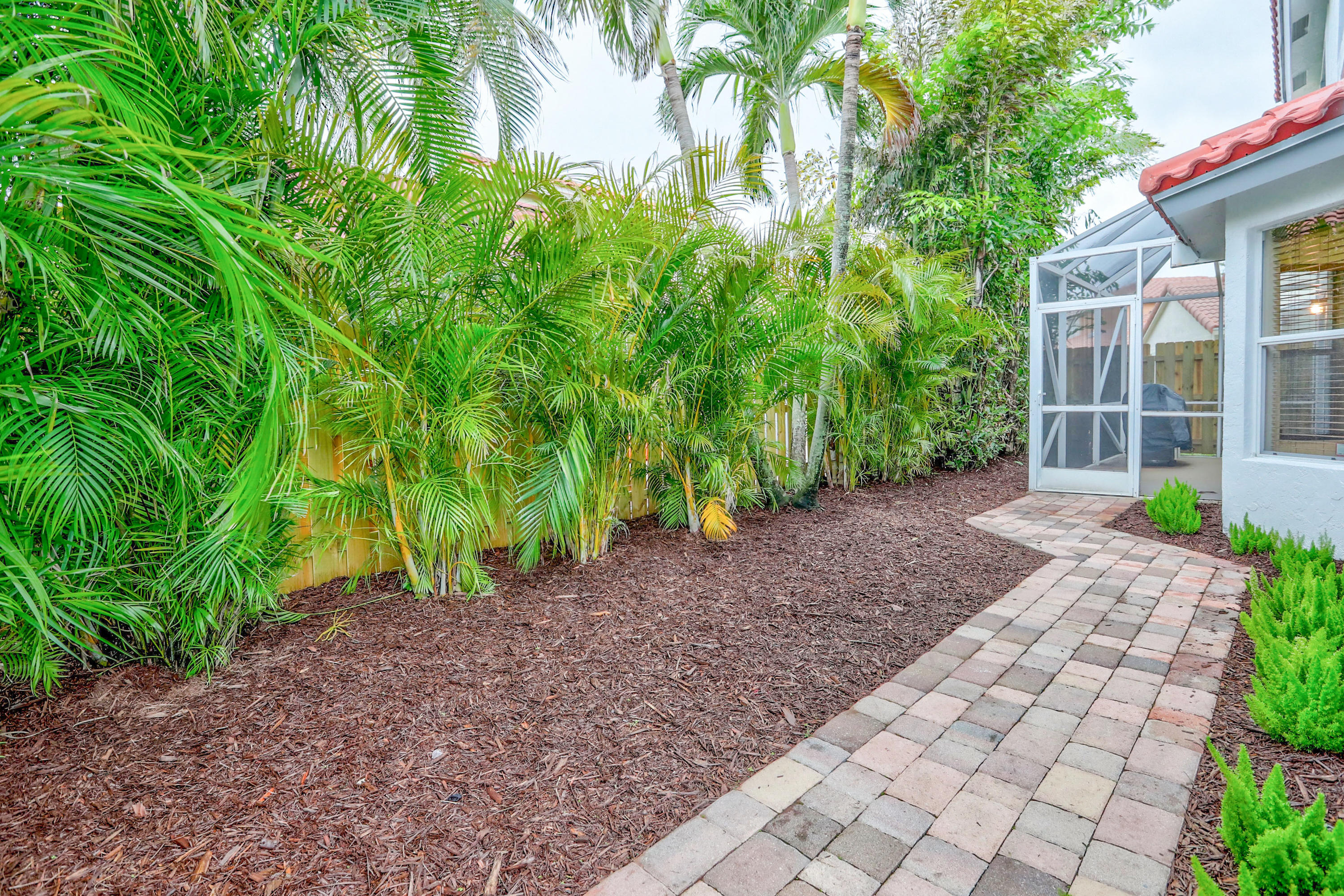 10620 Lake Jasmine Drive Boca Raton, FL 33498 - Photo 31 of 41 a view of a backyard with plants