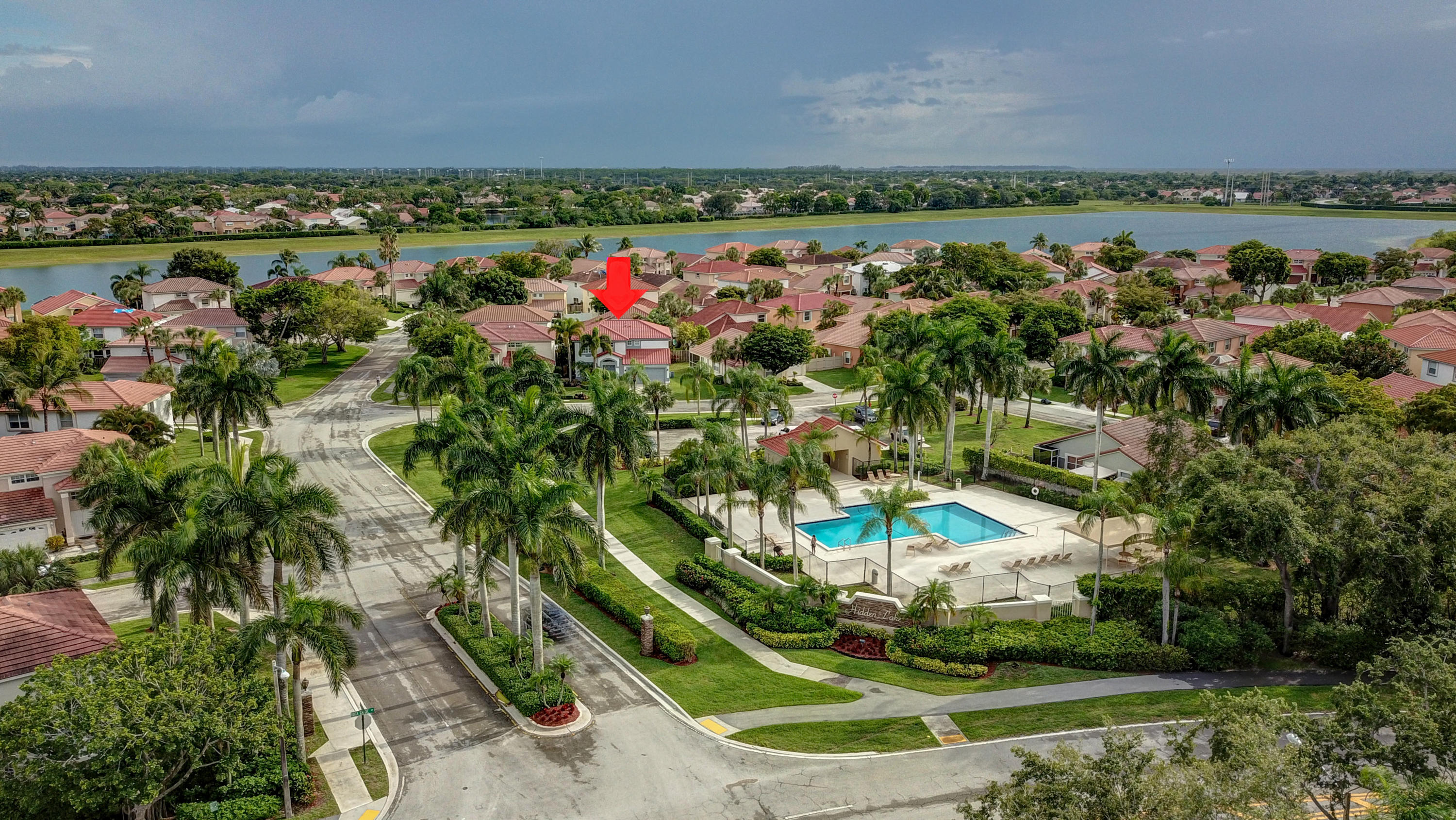 10620 Lake Jasmine Drive Boca Raton, FL 33498 - Photo 34 of 41 an aerial view of a residential houses with outdoor space and trees