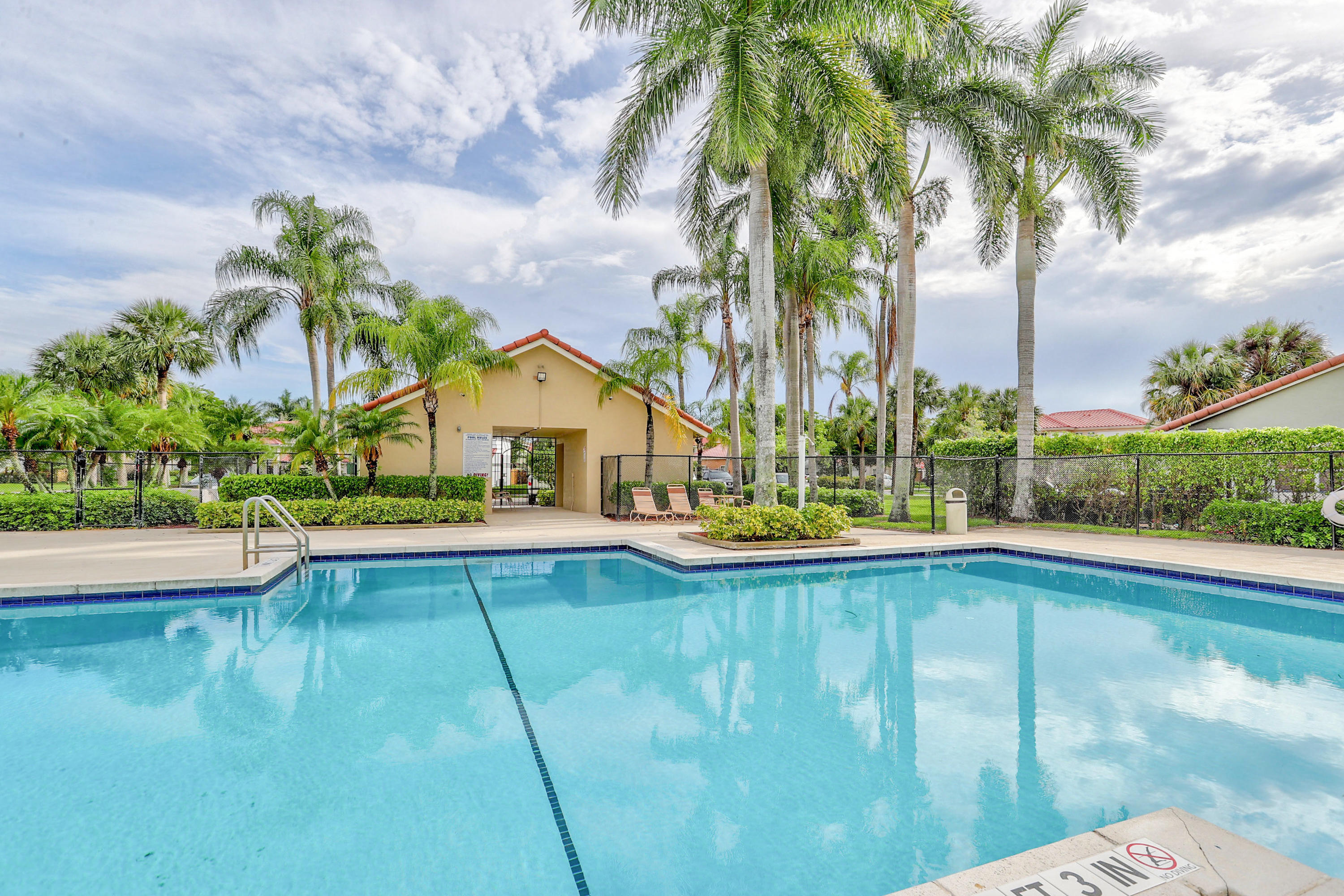 10620 Lake Jasmine Drive Boca Raton, FL 33498 - Photo 36 of 41 a view of swimming pool and lake view
