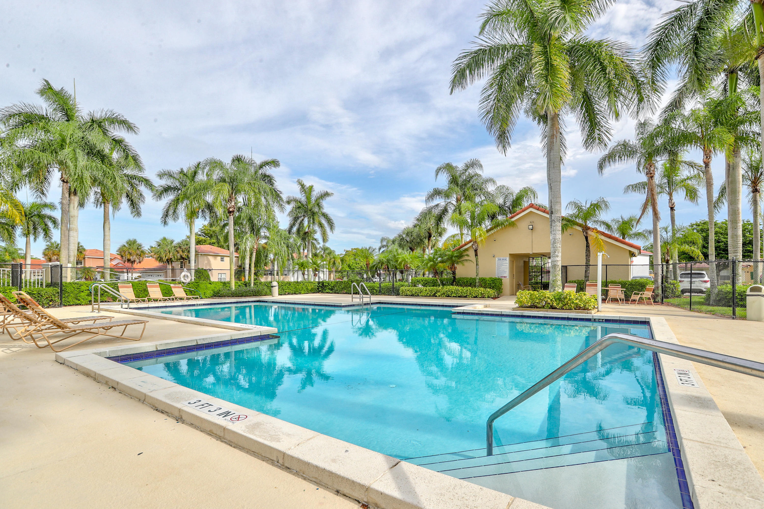 10620 Lake Jasmine Drive Boca Raton, FL 33498 - Photo 37 of 41 a view of swimming pool with outdoor seating and house in the background