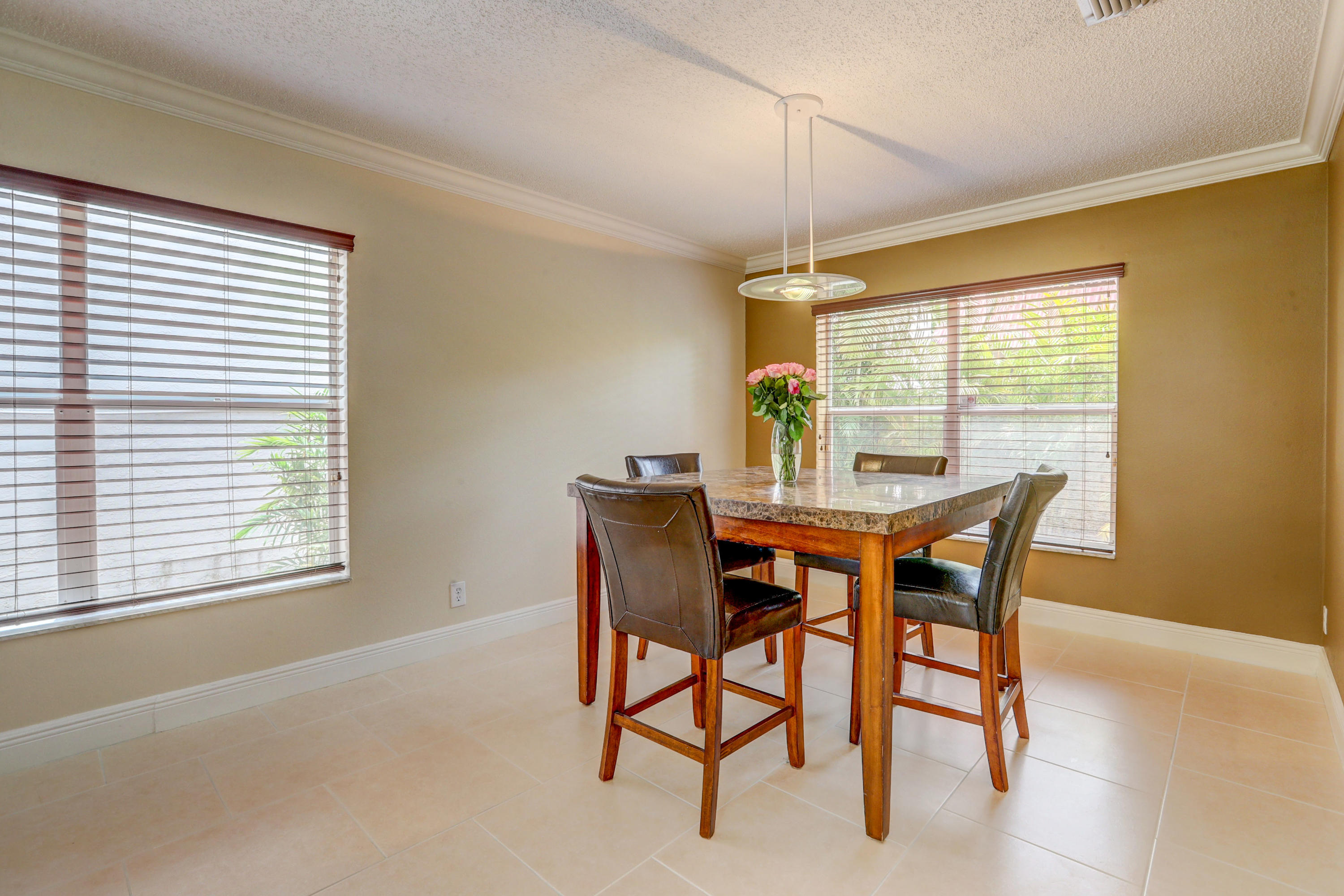 10620 Lake Jasmine Drive Boca Raton, FL 33498 - Photo 8 of 41 a dining room with furniture and window