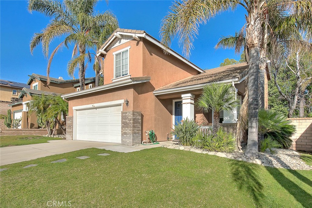 6699 Summerstone Court Rancho Cucamonga, CA 91701 - Photo 1 of 1 a front view of a house with a yard