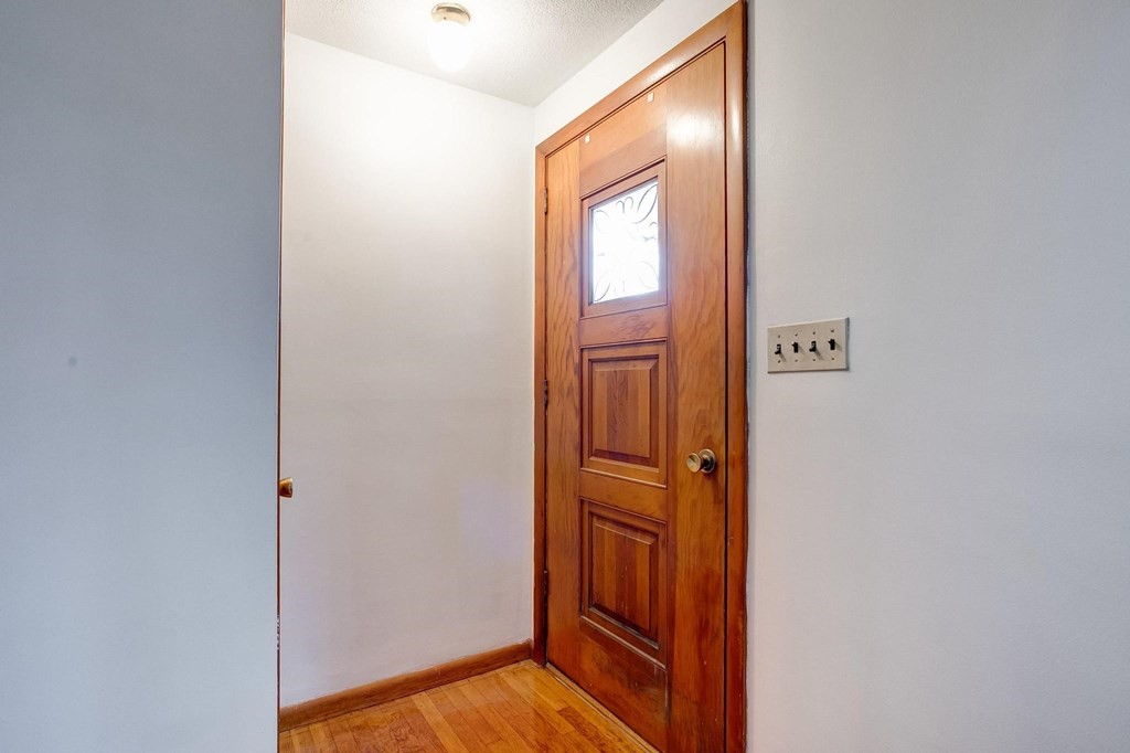 29 Basse Circle Lynn, MA 01905 - Photo 11 of 32 a view of a hallway with wooden floor