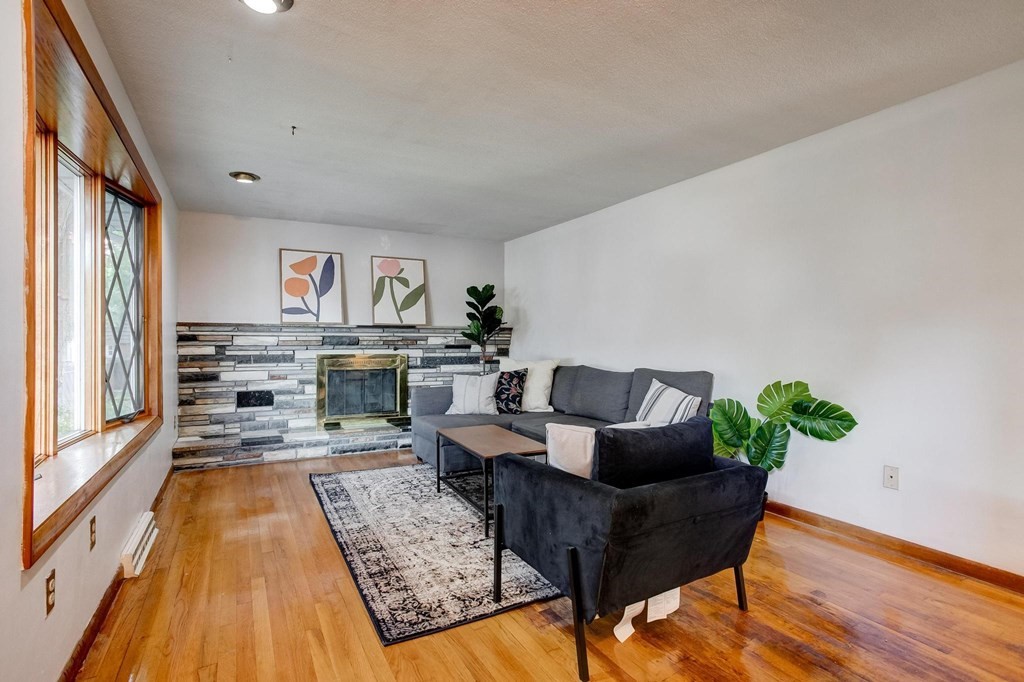 29 Basse Circle Lynn, MA 01905 - Photo 12 of 32 a living room with furniture and a wooden floor