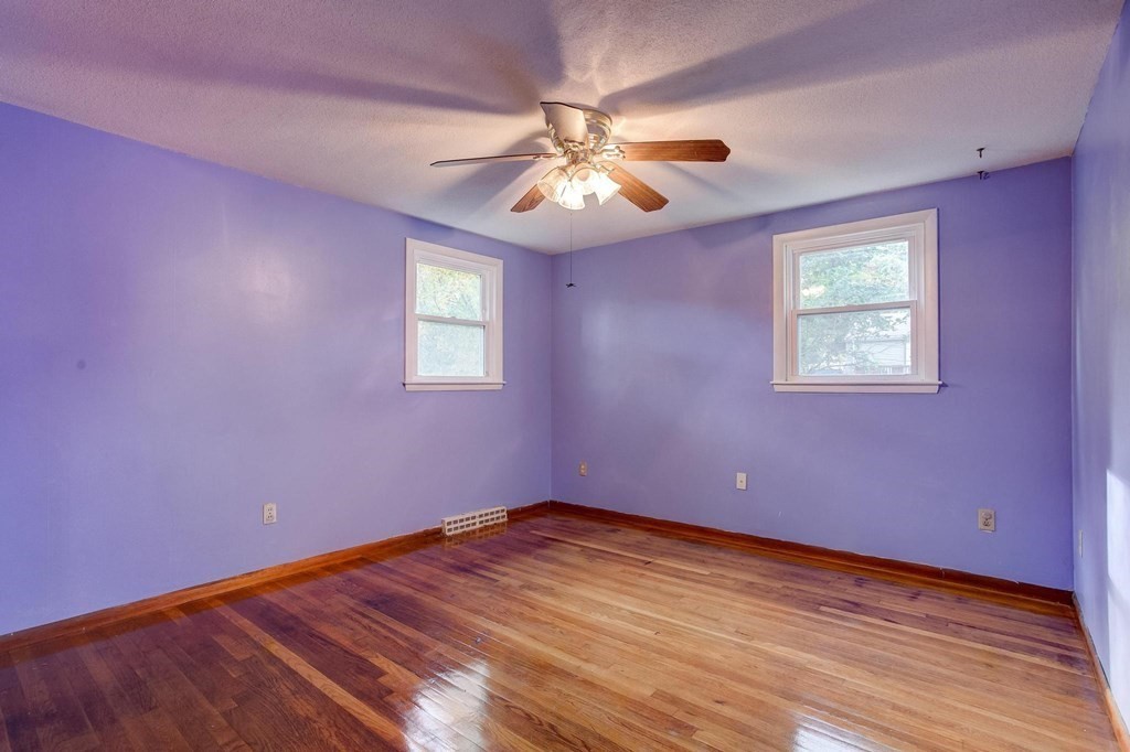 29 Basse Circle Lynn, MA 01905 - Photo 23 of 32 a view of an empty room with wooden floor and a window