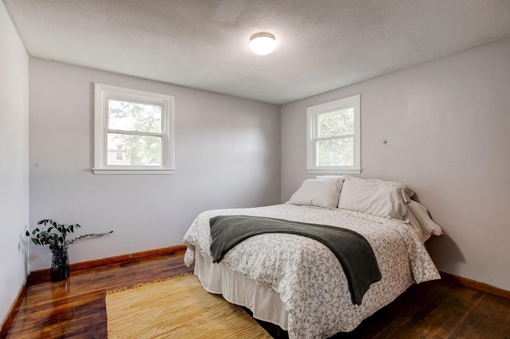 29 Basse Circle Lynn, MA 01905 - Photo 25 of 32 a bed sitting in a bedroom next to a window