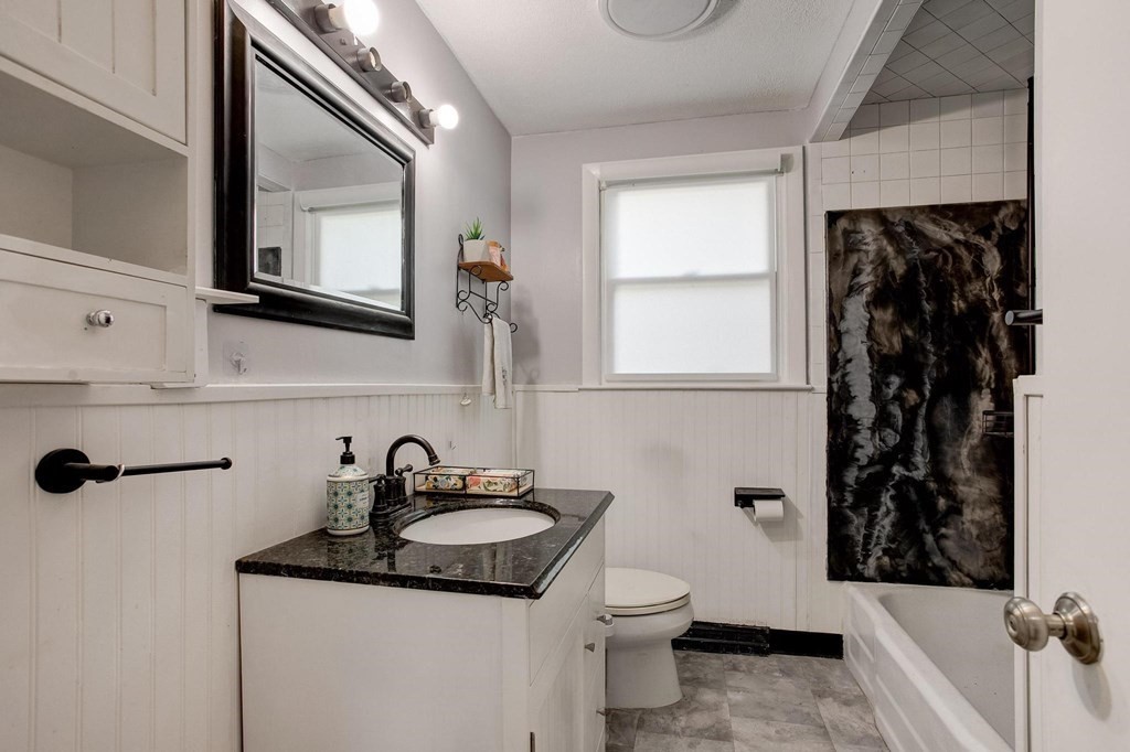 29 Basse Circle Lynn, MA 01905 - Photo 27 of 32 a bathroom with a sink toilet a mirror and shower