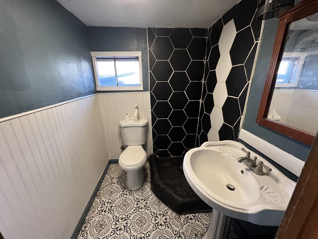 29 Basse Circle Lynn, MA 01905 - Photo 30 of 32 a bathroom with a sink and mirror with toilet