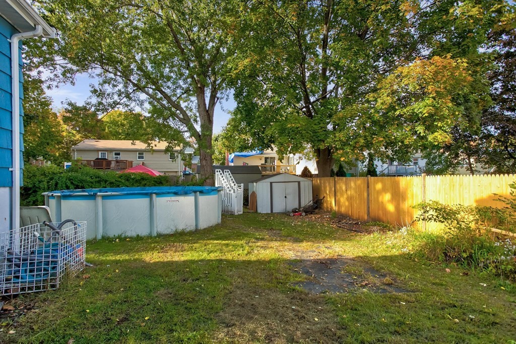 29 Basse Circle Lynn, MA 01905 - Photo 4 of 32 a view of a backyard with a small pool