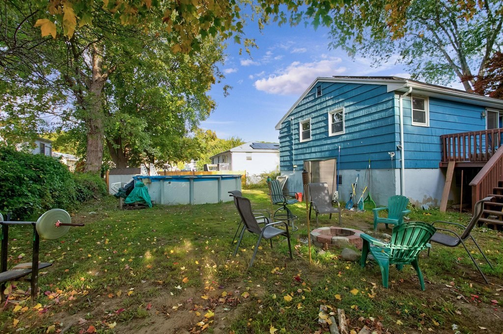 29 Basse Circle Lynn, MA 01905 - Photo 7 of 32 a view of a chair and table in backyard