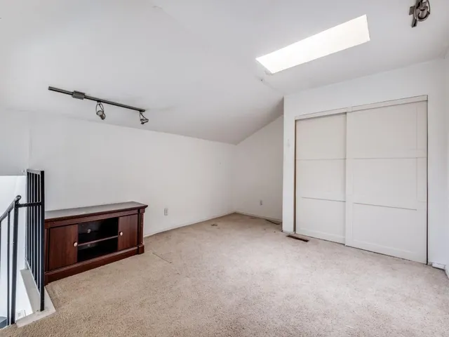 an empty room with a fireplace