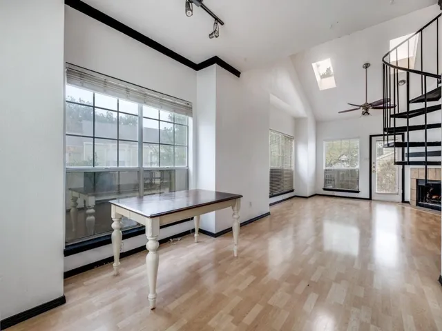 a view of a room with gym equipment and a window