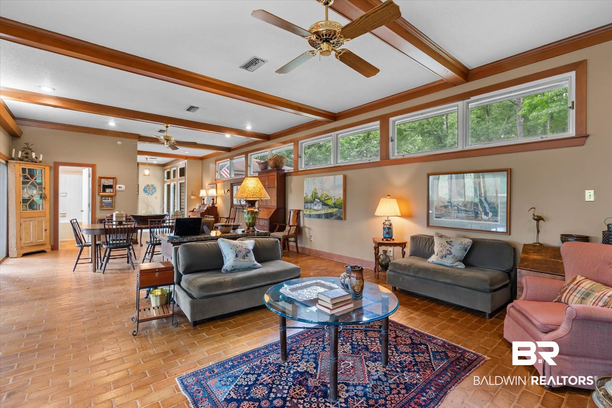3500 Venetia Road Mobile, AL 36605 - Photo 13 of 56 Spacious room featuring brick flooring, exposed wood ceiling beams, and transom windows