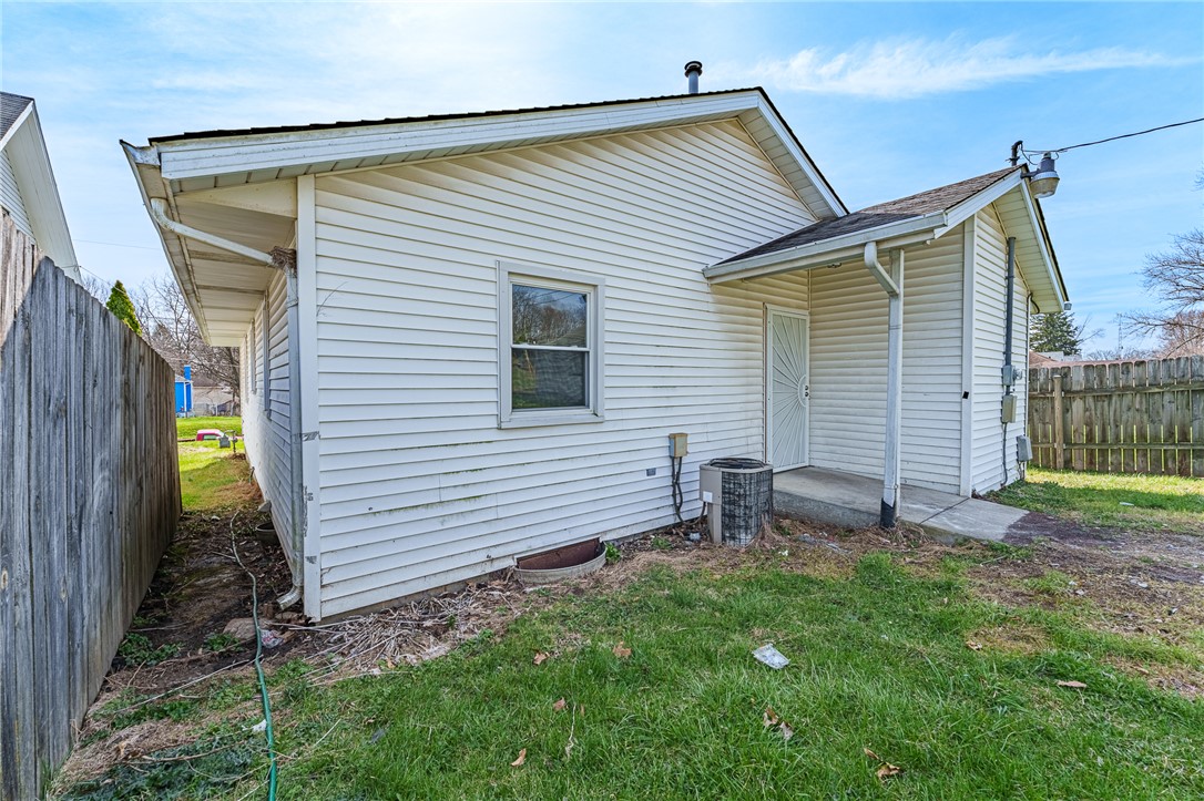 1005 Burt Street Springfield, OH 45505 - Photo 26 of 33 This residence features white siding, a practical entryway, and a verdant yard.