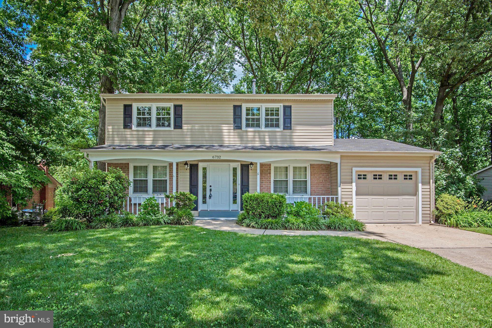 a house view with a garden space