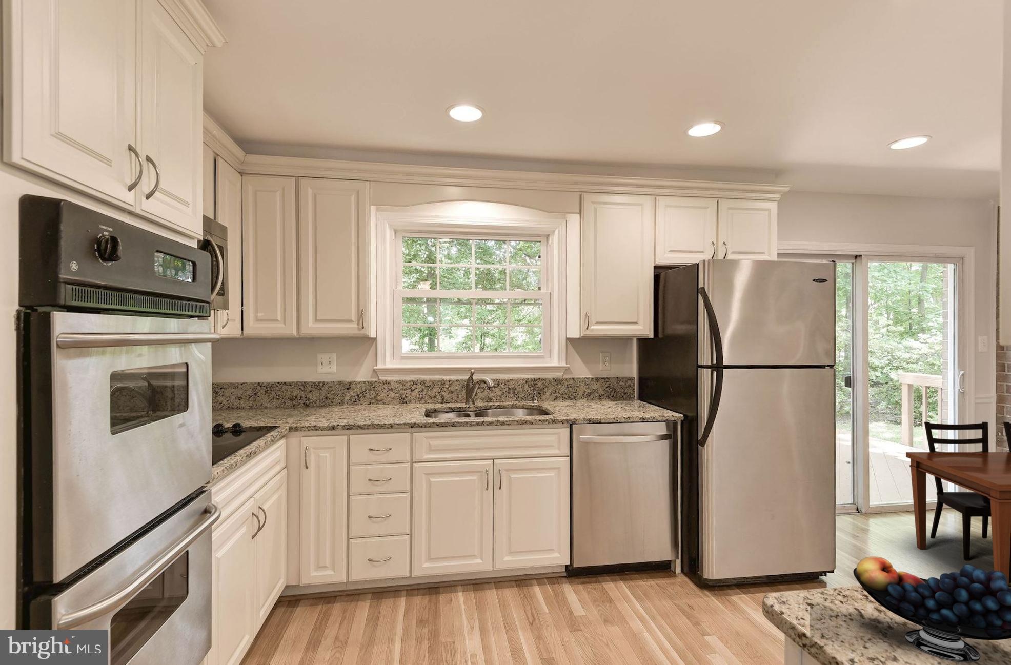 6732 Huntsman Boulevard Springfield, VA 22152 - Photo 2 of 23 a kitchen with stainless steel appliances a refrigerator sink and microwave