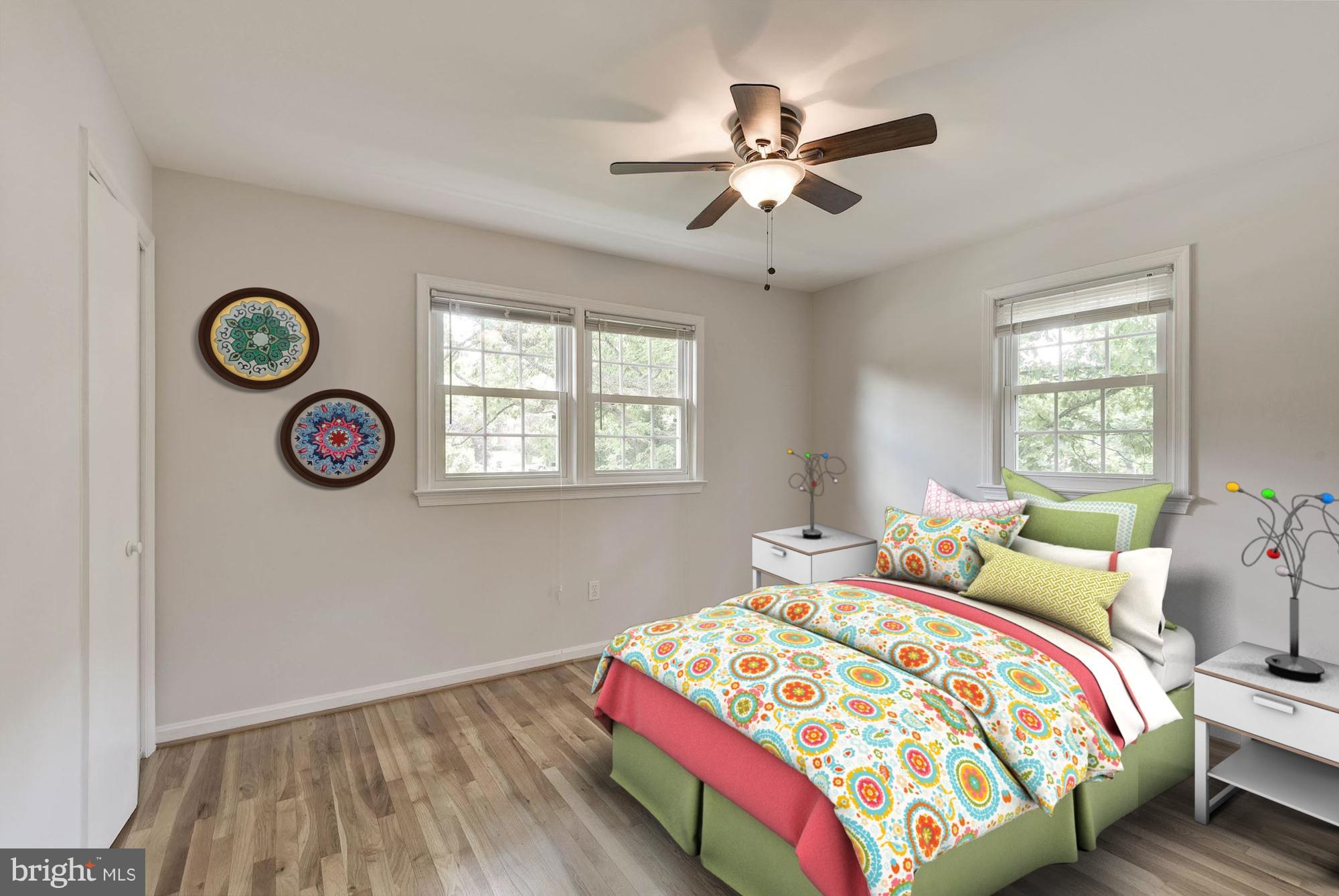 6732 Huntsman Boulevard Springfield, VA 22152 - Photo 13 of 23 a bedroom with bed and a window