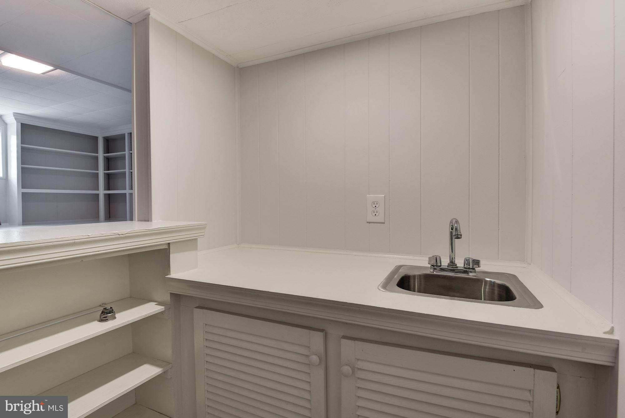 6732 Huntsman Boulevard Springfield, VA 22152 - Photo 19 of 23 a kitchen with a sink and a window