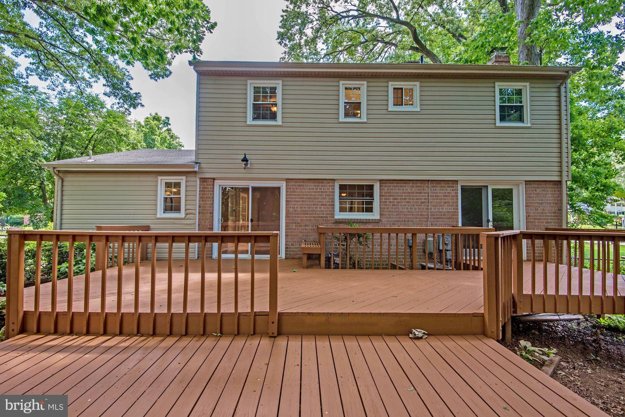 6732 Huntsman Boulevard Springfield, VA 22152 - Photo 21 of 23 a view of a house with wooden deck
