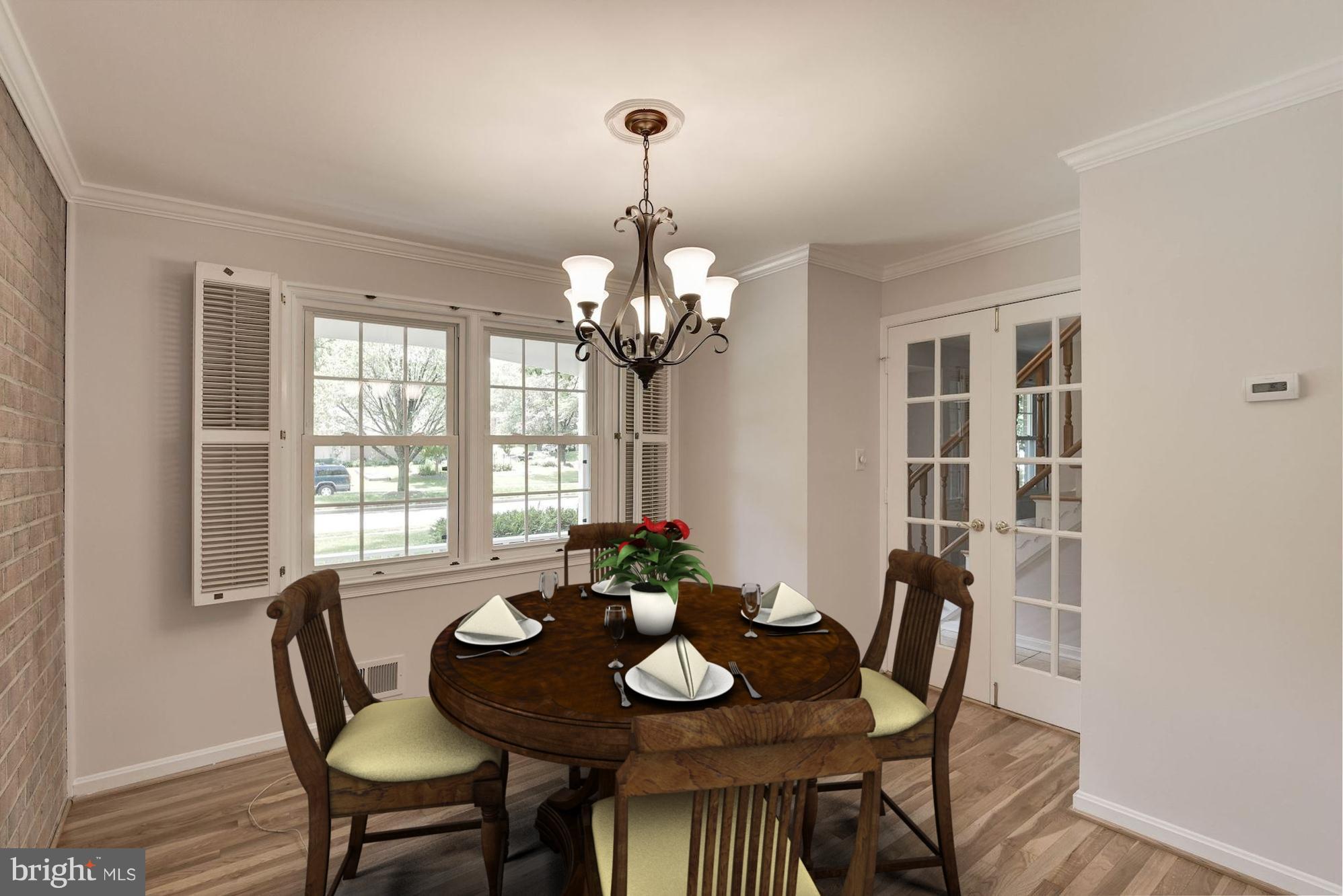 6732 Huntsman Boulevard Springfield, VA 22152 - Photo 7 of 23 a view of a dining room with furniture window and wooden floor