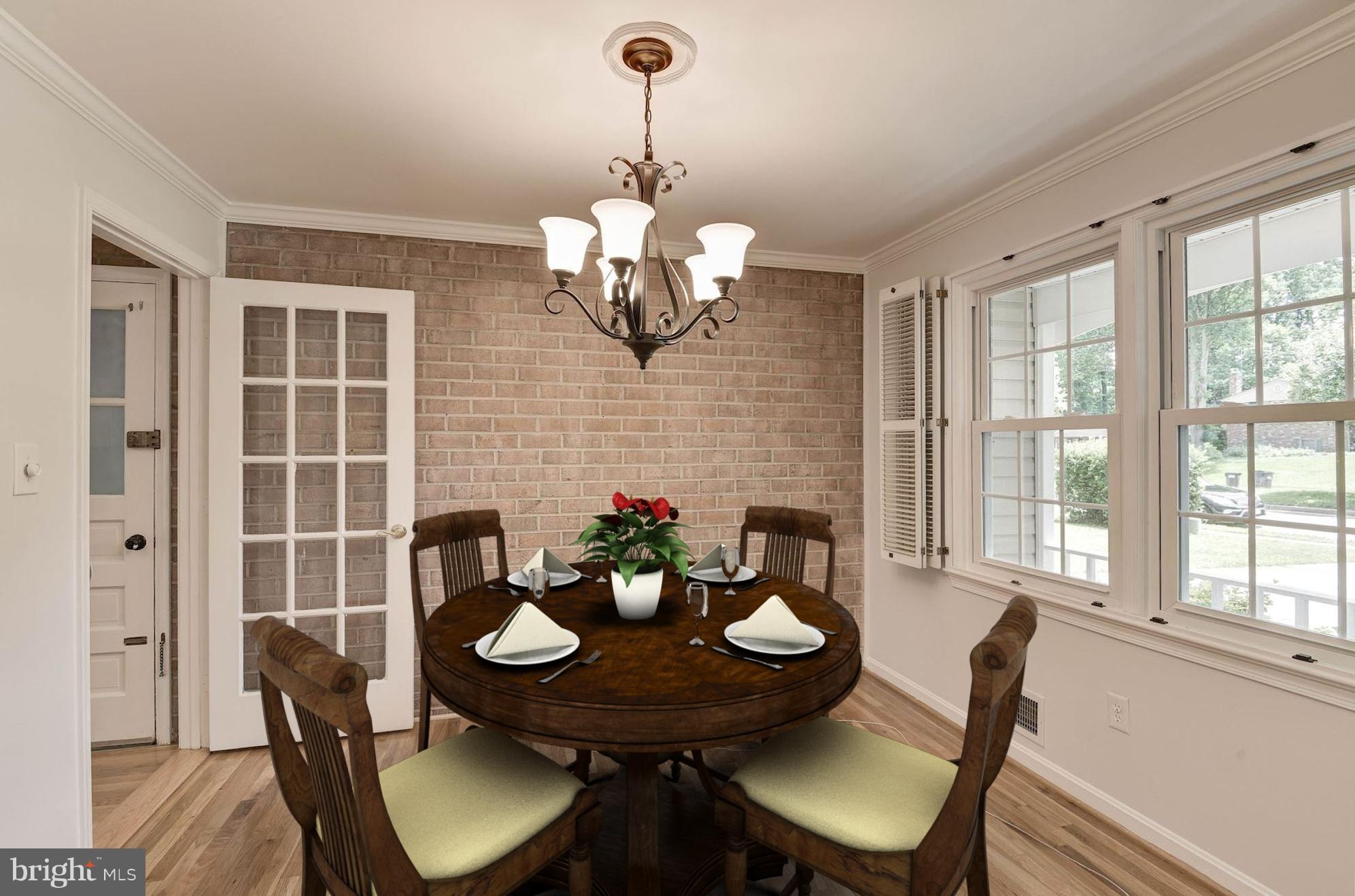 6732 Huntsman Boulevard Springfield, VA 22152 - Photo 8 of 23 a view of a dining room with furniture wooden floor and chandelier