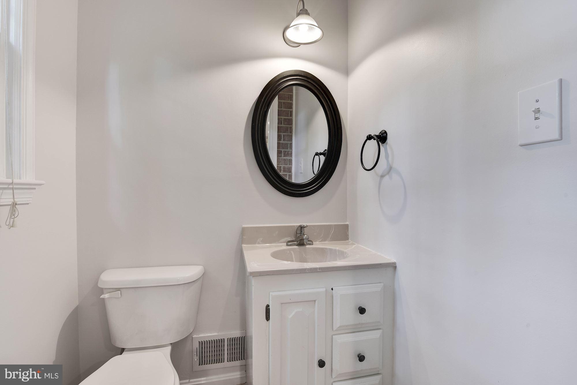 6732 Huntsman Boulevard Springfield, VA 22152 - Photo 9 of 23 a bathroom with a sink and a toilet