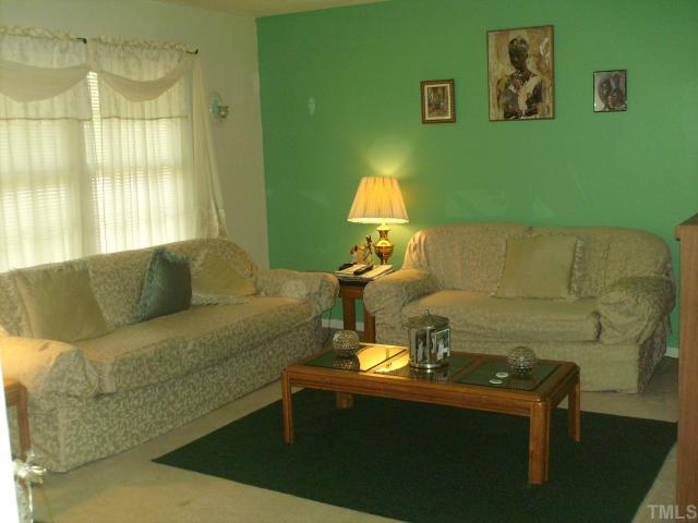 923 Edison Road Raleigh, NC 27610 - Photo 3 of 12 a living room with furniture and a window
