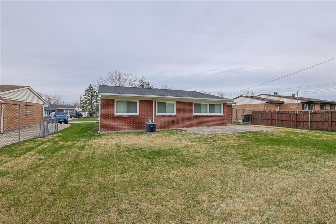4307 Meadowcroft Road Dayton, OH 45429 - Photo 26 of 26 This residence features a large backyard with a concrete patio, perfect for outdoor activities and relaxation.