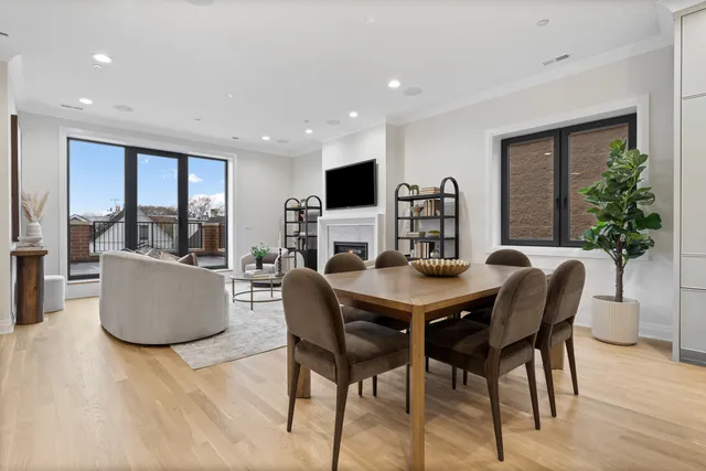 a spacious bedroom with a bed and a large window
